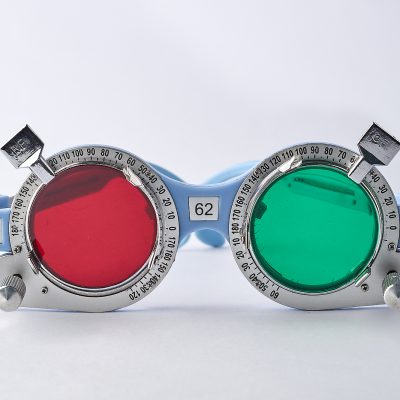 Optometrist medical equipment tools of red filter on trial frame test, Equipment tool for test vision exam isolated on white background.Optometrist medical equipment tools of green filter on trial frame test, Equipment tool for test vision exam isolated o